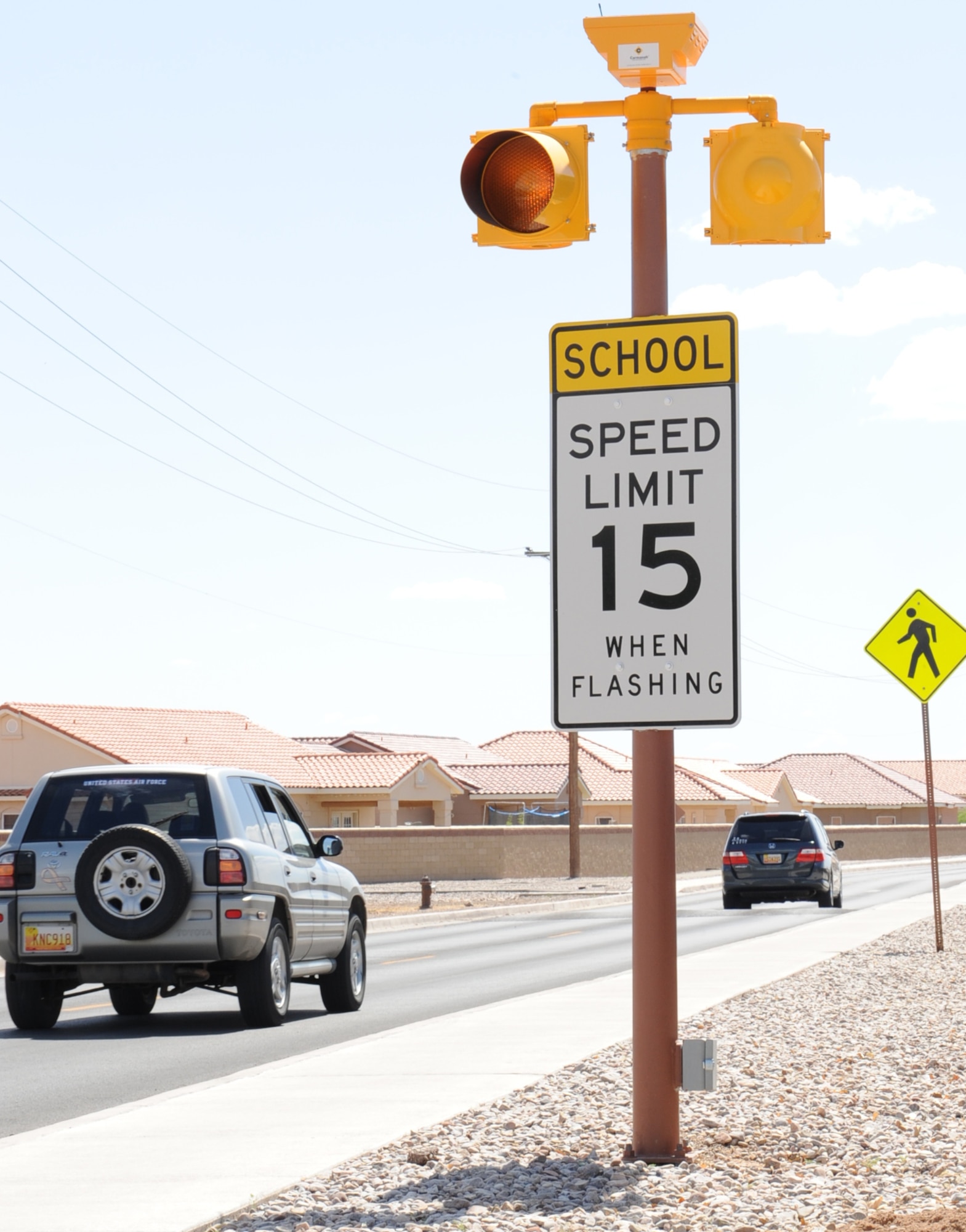 Vehicles pass through the school speed zone, April 23, at Holloman Air Force Base, N.M. Team Holloman members are asked to slow down and observe the posted speed limits in school zones as children complete the last month of school. May 22 is the last day of school for Holloman, Alamogordo, Cloudcroft and Tularosa. (U.S. Air Force photo/Senior Airman Rachel Kocin)