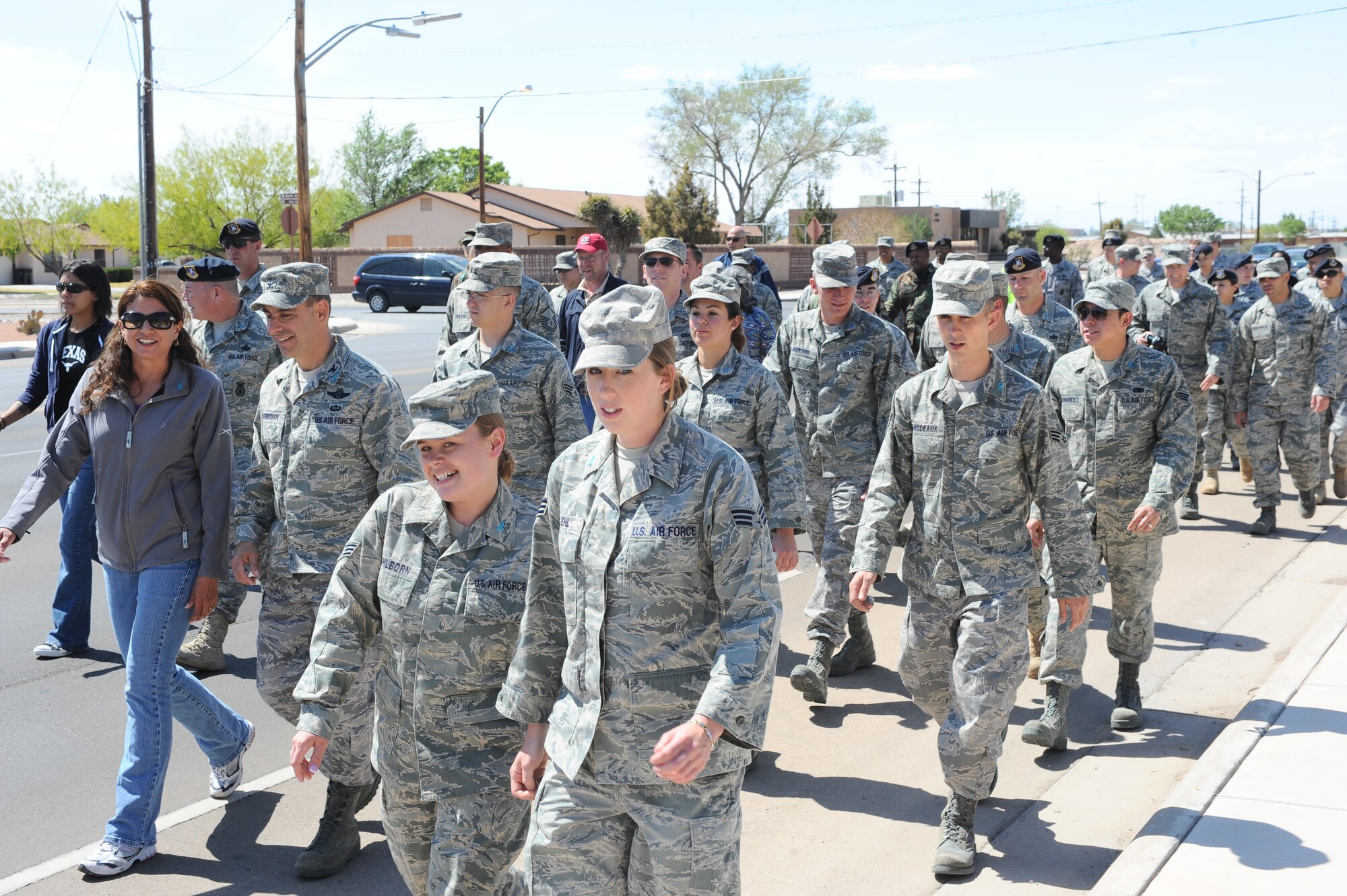 Holloman Air Force Base personnel participate in the 1st annual "My Strength is Defending" Walk for Sexual Assault Awareness. About 150 Holloman personnel participated in the mile-long walk, April 17. April is Sexual Assault Awareness Month. (U.S. Air Force photo/ Airman 1st Class DeAndre Curtiss)