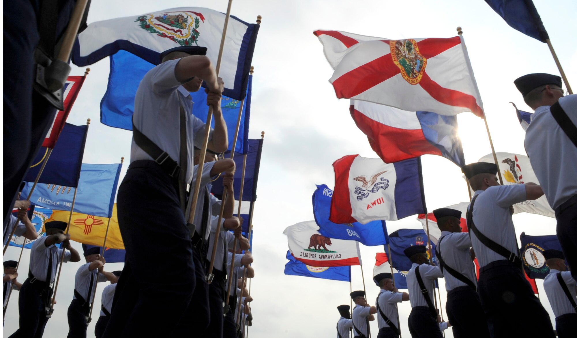 Basic trainees carry state flags during their graduation ceremony April 24 at Lackland Air Force Base, Texas. (U.S. Air Force photo/Staff Sgt. Desiree N. Palacios)