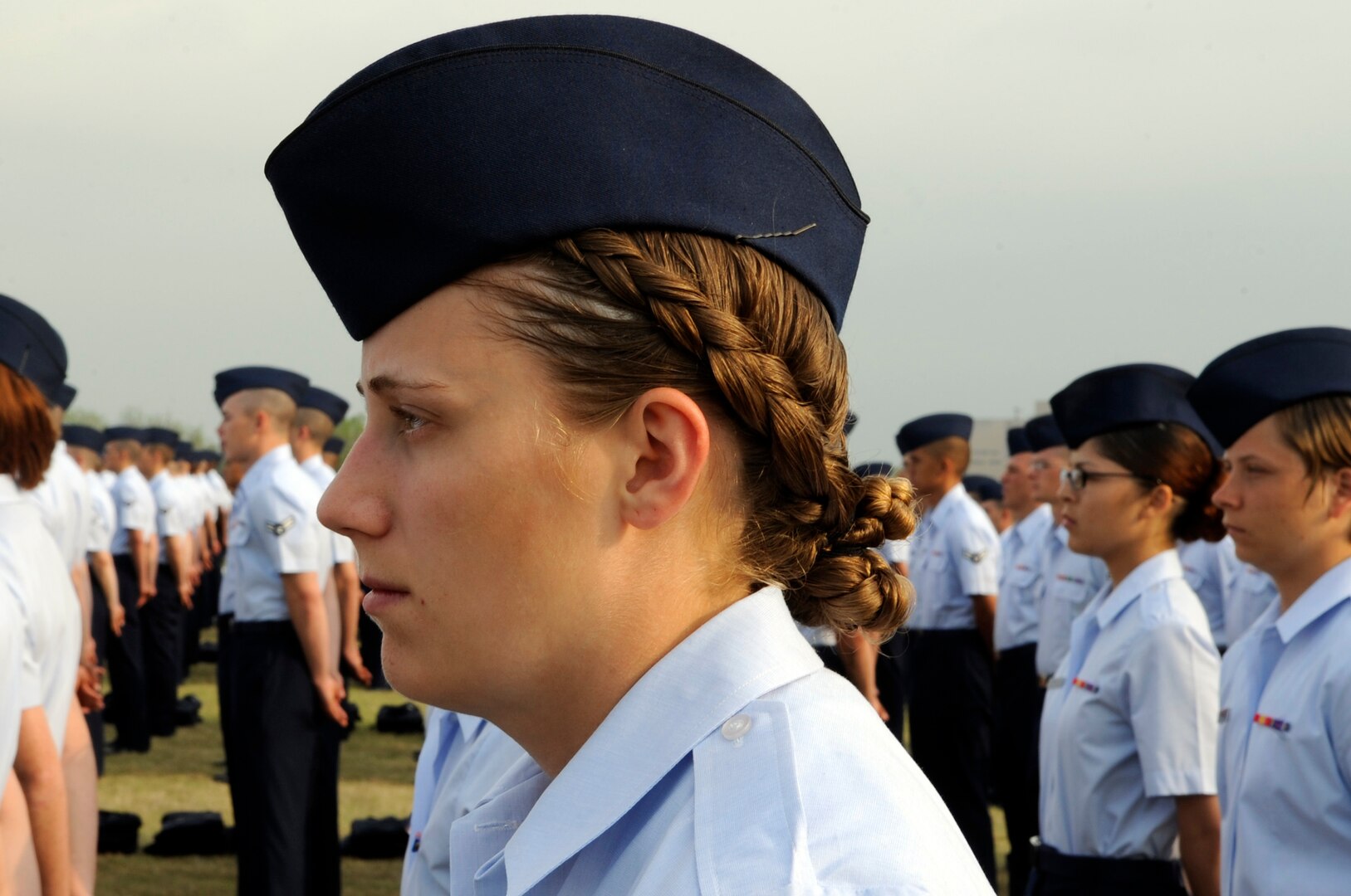 Basic trainees stand at parade rest during their graduation ceremony April 24 at Lackland Air Force Base, Texas. (U.S. Air Force photo/Staff Sgt. Desiree N. Palacios)