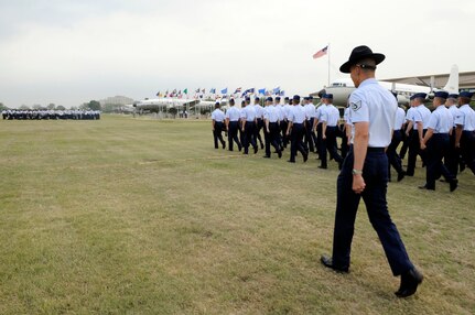 A military training instructor marches his flight on the parade grounds at Lackland Air Force Base, Texas, April 24 for their graduation ceremony. (U.S. Air Force photo/Staff Sgt. Desiree N. Palacios)

