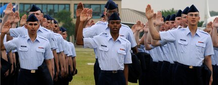 Basic trainees raise their right hand April 24 as they recite the oath of enlistment at Lackland Air Force Base, Texas. (U. S. Air Force photo/Staff Sgt. Desiree N. Palacios)