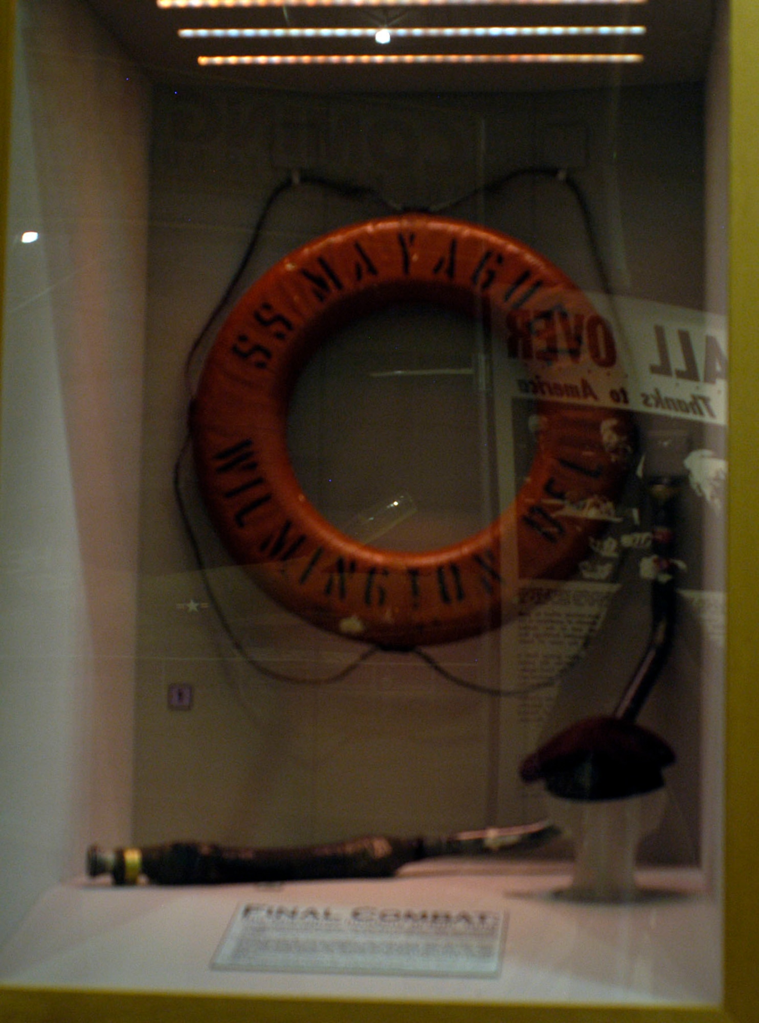 DAYTON, Ohio - In this case is a life ring from the SS Mayaguez. The ship was launched in 1944, and beginning in 1965 sailed a regular route from Hong Kong to Thailand and Singapore carrying supplies in support of U.S. forces in Southeast Asia. The Mayaguez was scrapped in 1979. USAF pararescueman Wayne Fisk wore this beret during the Mayaguez operation. He was on the last helicopter to leave Koh Tang. This instrument panel stopped a bullet. The panel is from an HH-53 helicopter that attempted under fire to rescue the crew of another helicopter downed in the opening minutes of the Koh Tang operation. (U.S. Air Force photo)