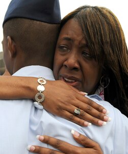 A new Airman receives a hug from his mother after his graduation from basic training April 24 at Lackland Air Force Base, Texas. (U.S. Air Force photo/Staff Sgt. Desiree N. Palacios)