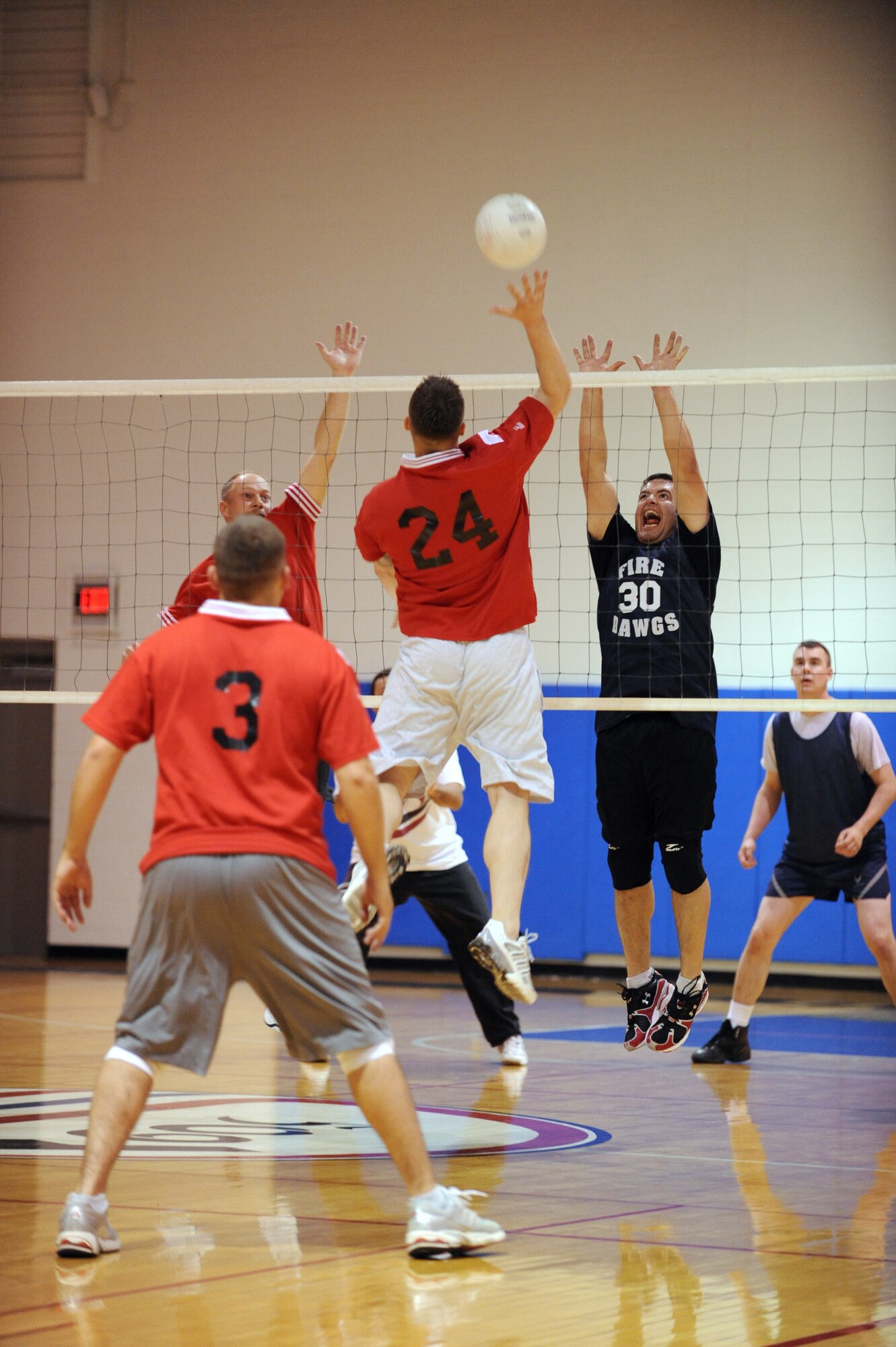 WHITEMAN AIR FORCE BASE, Mo. - A member of the 509th Munitions Squadron volleyball team sends the ball to the 509th Civil Engineer Squadron side during the championship game April 22. MUNS topped CES  in both matches to win the championship.