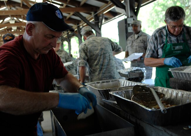 Chief Master Sgt. George Babcheck fries fish during the Chief's fish fry held at the picnic grounds here April 24. The fish fry began as a barbeque in 1987 as a way to bring the reserve and active-duty units on Charleston AFB together. Chief Babcheck is assigned to the 315th Aircraft Maintenance Squadron. (U.S. Air Force photo/Senior Airman Katie Gieratz)