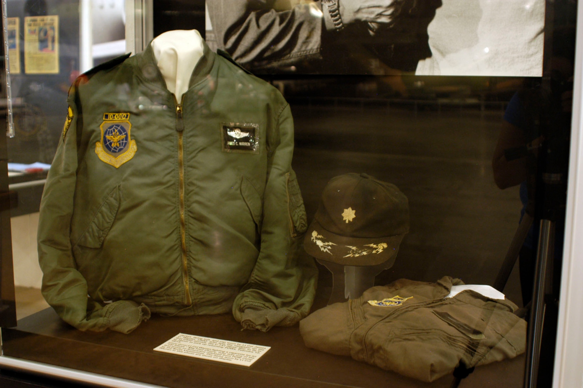 DAYTON, Ohio - Flying suit, jacket, and cap worn by Lt. Col. James C. Warren, USAF, who was the navigator on the first USAF aircraft, the C-141 Hanoi Taxi, to fly into Hanoi to pick up returning POWs, Feb. 12, 1973. These items are on display in the Southeast Asia War Gallery at the National Museum of the U.S. Air Force. (U.S. Air Force photo)