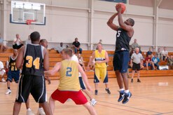 Clinton Coleman shoots a two-point jump shot during the base intramural basketball championship game at the Fitness and Sports Center here April 23. Coleman scored nine points during the game and was the second highest scorer for his team. The 437th Civil Engineer Squadron defeated the 437th Force Support Squadron 47-31.Coleman is assigned to the 437 FSS. (U.S. Air Force photo/Staff Sgt. Marie Cassetty)(RELEASED)