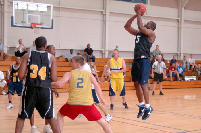 Clinton Coleman shoots a two-point jump shot during the base intramural basketball championship game at the Fitness and Sports Center here April 23. Coleman scored nine points during the game and was the second highest scorer for his team. The 437th Civil Engineer Squadron defeated the 437th Force Support Squadron 47-31.Coleman is assigned to the 437 FSS. (U.S. Air Force photo/Staff Sgt. Marie Cassetty)(RELEASED)