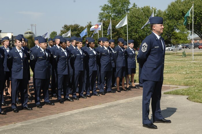 Chief Master Sgt. Mike Ivey stands at parade rest with other enlisted members of Team Charleston during a special retreat ceremony on Charleston AFB April 24. The retreat ceremony was a tribute to Col. John "Red" Millander for his final weeks here. Colonel Millander is the 437th Airlift Wing commander and Chief Ivey is the 437th Airlift Wing command chief. (U.S. Air Force photo/Senior Airman Katie Gieratz)