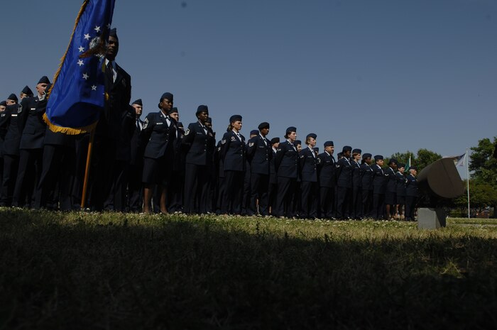 Enlisted Team Charleston members stand at parade rest before the retreat ceremony April 24 on Charleston AFB. The retreat ceremony was a tribute to Col. John "Red" Millander for his final weeks here. Colonel Millander is the 437th Airlift Wing commander. (U.S. Air Force photo/Senior Airman Katie Gieratz)