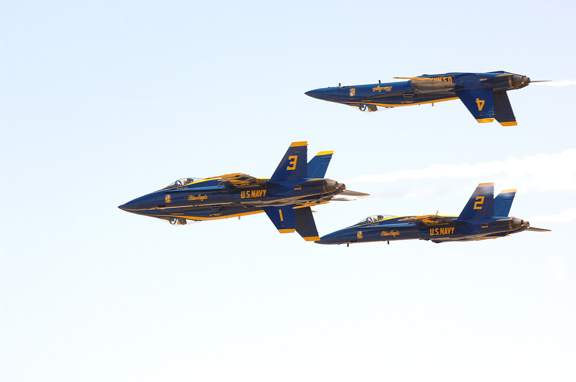Members of the U.S. Navy's Blue Angels flight demonstration team perform the "Double Farvel" maneuver at Seymour Johnson Air Force Base, N.C., April 26, 2009.  Blue Angel pilots, selected from the Navy and Marines, complete 120 training flights prior to the show season, March thru November, to ensure safety and aerial precision.  The Blue Angels, performing since 1946, will have an estimated 15 million spectators view the aerial demonstration squadron during air shows this year.  (U.S. Air Force Photo by 2nd Lt. Matthew D. Schroff)