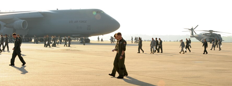 In order to prevent aircraft damage, 4th Fighter Wing Airmen walk the flight line, looking for loose debris following the Wings Over Wayne Airshow at Seymour Johnson Air Force Base, N.C., April 27, 2009. In fiscal year 2000 alone, damage from loose debris cost the Air Force nearly $24 million, diverting valuable resources needed for the readiness of Air Expeditionary Forces. (U.S. Air Force photo by Airman 1st Class Gino Reyes)