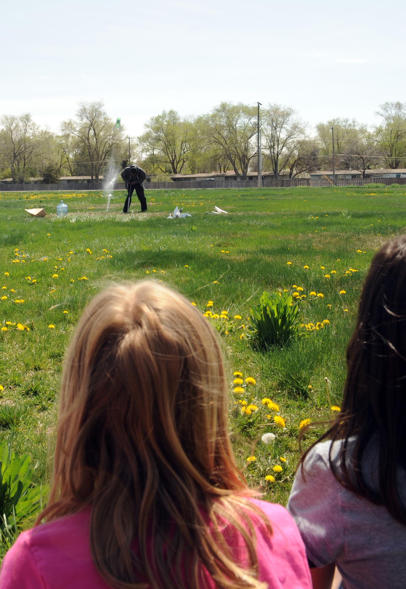 MOUNTAIN HOME AIR FORCE BASE, Idaho -- Second grade students from the base primary school watch as rockets they built are launched in front of the base primary school April 24. Students learned the fundamentals of rocketry, and then put the lesson to use by building rockets and launching them in front of the school. The event was part of the school’s annual science day event that included hands-on lessons in various scientific fields as well as guest speakers from the 366th Medical Group and the Bureau of Land Management. (U.S. Air Force photo by Airman 1st Class Debbie Lockhart)