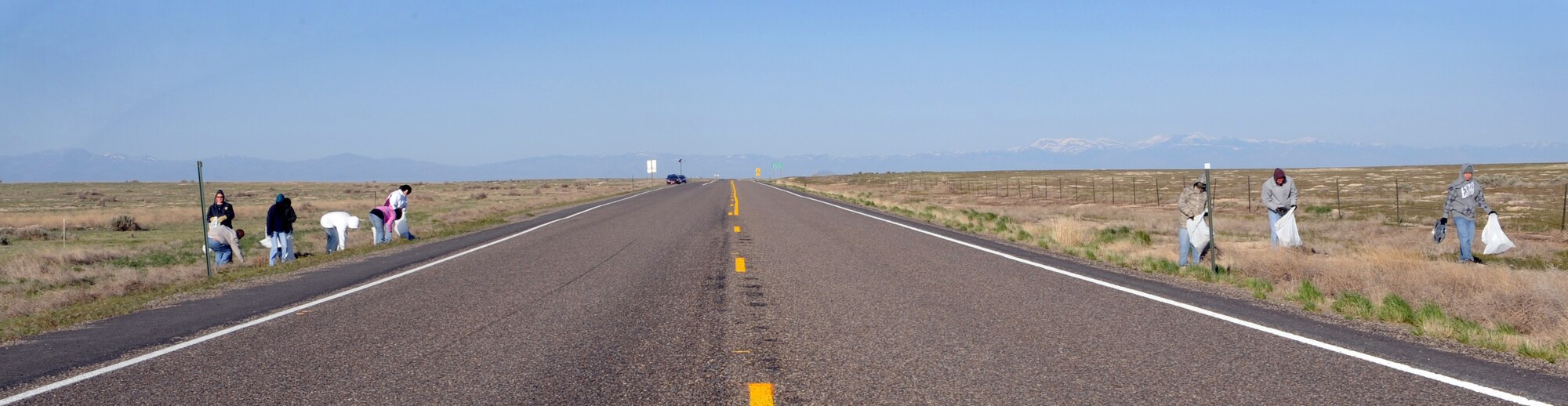 MOUNTAIN HOME AIR FORCE BASE, Idaho -- Volunteers with the Air Force Sergeants Association pick up trash along Grand View Highway April 25. More than 30 members of the local AFSA chapter cleaned a two-mile stretch of Grand View Highway as part of their Adopt-a-Highway program. (U.S. Air Force photo by Airman 1st Class Debbie Lockhart)