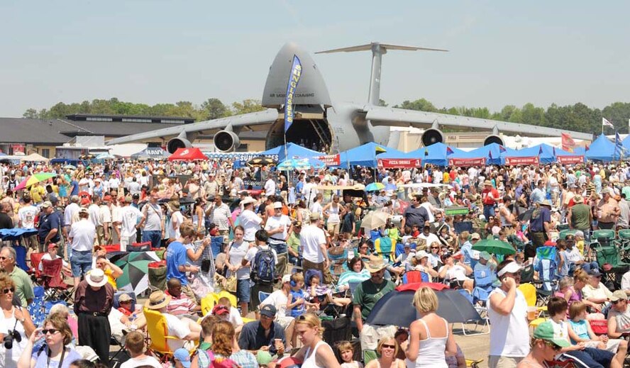 Spectators pack the flightline during the Wings Over Wayne Airshow at Seymour Johnson Air Force Base, N.C., April 25, 2009. Base officials estimated that more than 100,000 attended the air show and open house. The 4th Fighter Wing's own F-15E Strike Eagle demonstration team and the U.S. Navy Blue Angels performed along with other attractions. (U.S. Air Force photo by Airman 1st Class Gino Reyes)