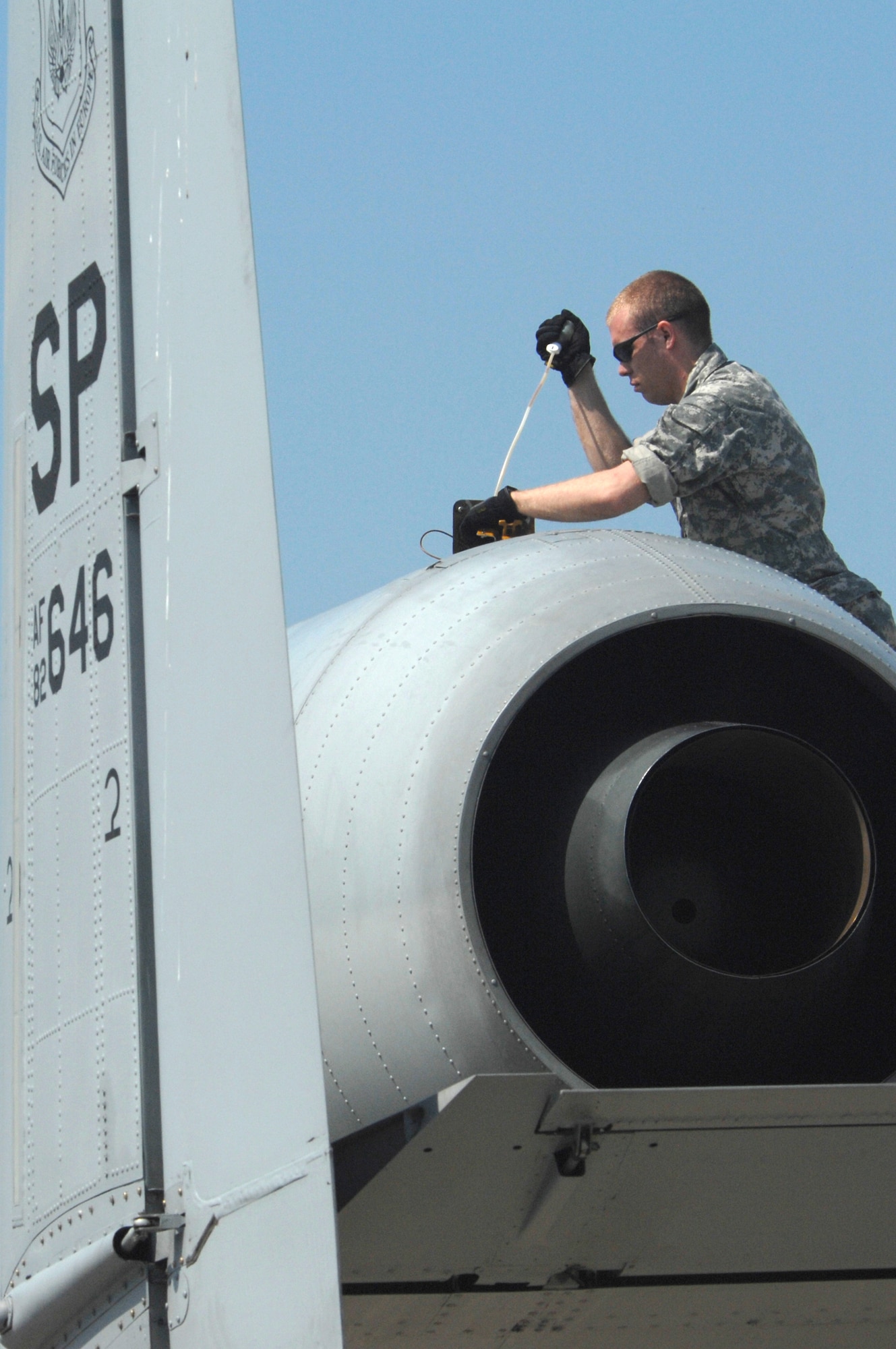 Airman 1st Class Josh Stubstad inspects the engine of an 81st Fighter Squadron A-10 Thunderbolt II April 16 at Bezmer Air Base, Bulgaria. A maintenance squadron team deployed to Bezmer AB to support Exercise Reunion April 2009. Airman Stubstad is a 52nd Equipment Maintenance Squadron crew chief from Spangdahlem Air Base, Germany. (U.S. Air Force photo/Master Sgt. Bill Gomez) 