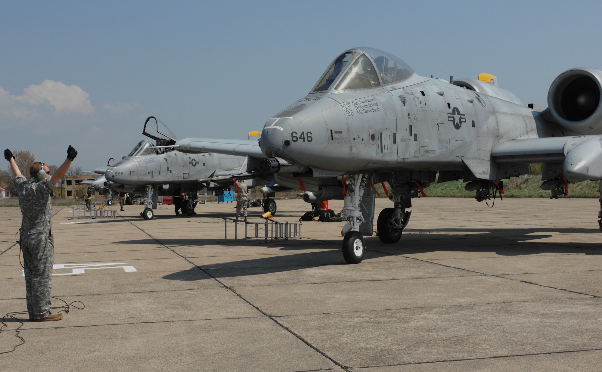 Airman 1st Class Josh Stubstad marshalls in an 81st Fighter Squadron A-10 Thunderbolt II returning from a training mission April 16 at Bezmer Air Base, Bulgaria. A maintenance squadron team deployed to Bezmer AB to support Exercise Reunion April 2009. Airman Stubstad is a 52nd Equipment Maintenance Squadron crew chief from Spangdahlem Air Base, Germany. (U.S. Air Force photo/Master Sgt. Bill Gomez) 

