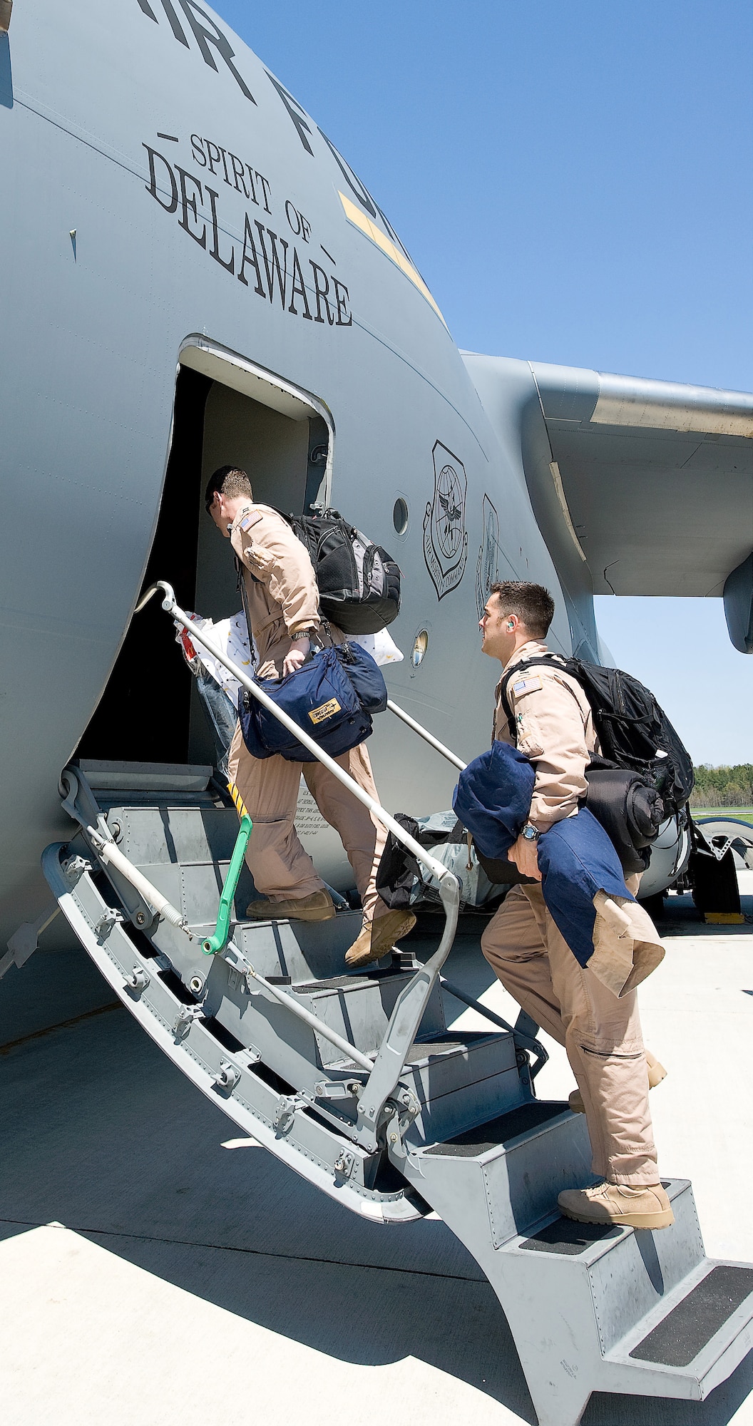 3rd Airlift Squadron members board the Spirit of Delaware, Dover?s newest C-17 Globemaster III, as they deploy to Southwest Asia April 24.  The deployment is the first squadron-wide deployment for the 3rd AS.  (U.S. Air Force photo\Roland Balik)