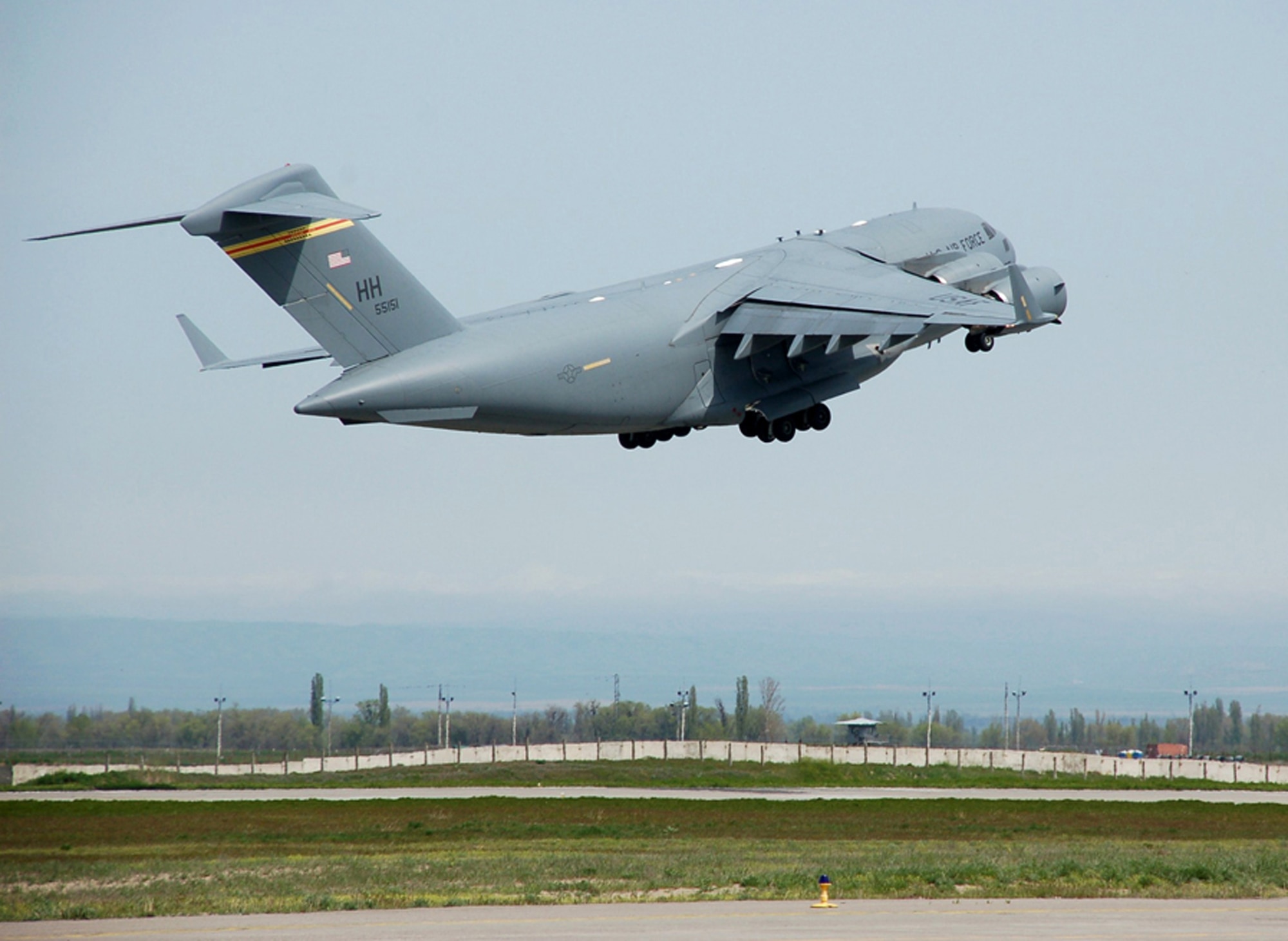 A C-17 Globemaster III from the 535th Airlift Squadron at Hickam Air Force Base, Hawaii, takes off from Manas Air Base, Kyrgyzstan, April 18 with a load of cargo destined for Afghanistan. For the past five weeks, three C-17 aircrews from Pacific Air Forces have been flying three flights nearly every day in order to deliver needed supplies for the buildup of various bases supporting Operation Enduring Freedom. (U.S. Air Force photo/Tech. Sgt. Phyllis Hanson)