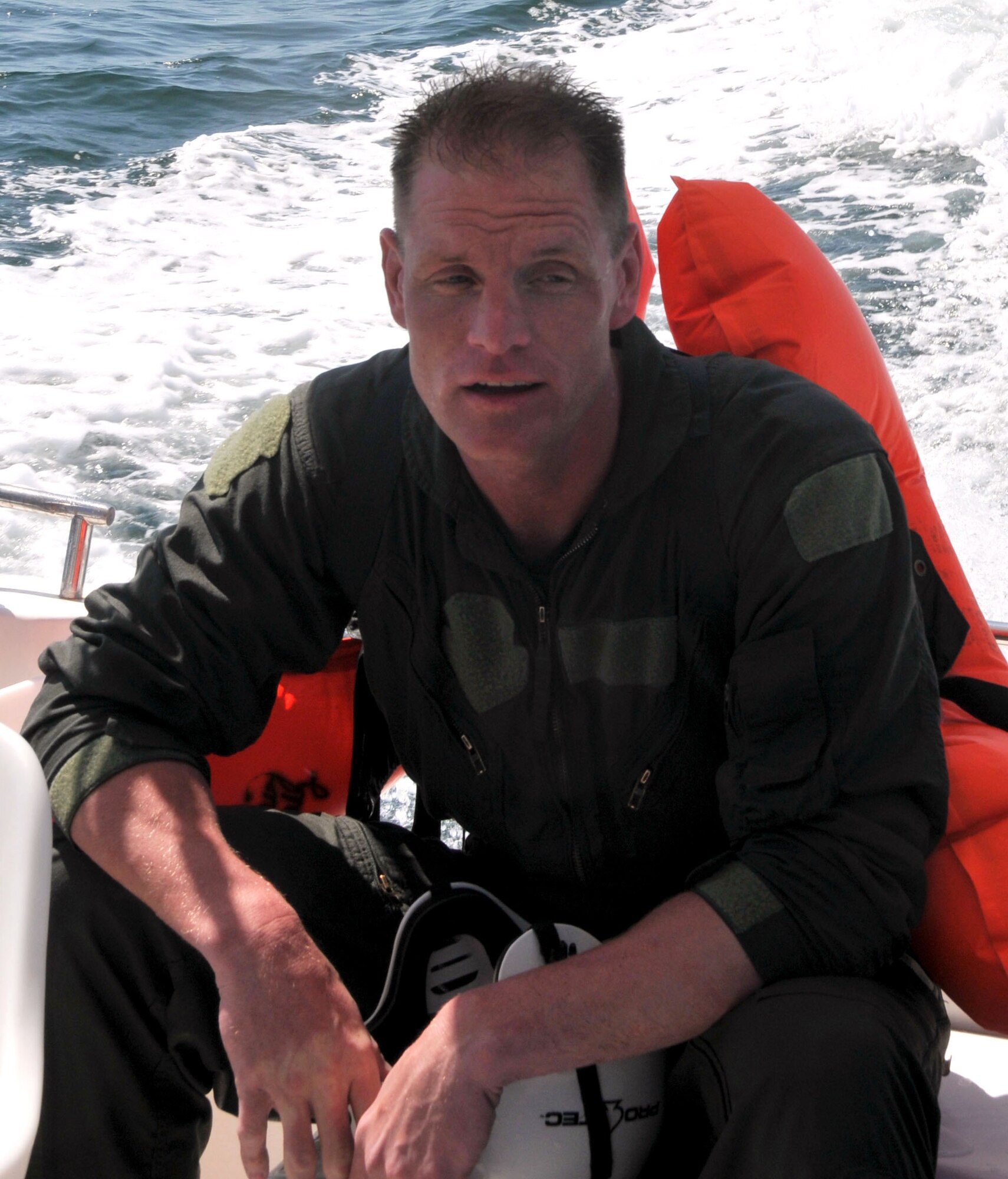 A wet, hungry and exhausted Senior Master Sgt. Shane Lohmann, readiness NCOIC for the 934 AES, rides back to shore after completing a 10-hour day of water survival training at NAS Key West, Fla.