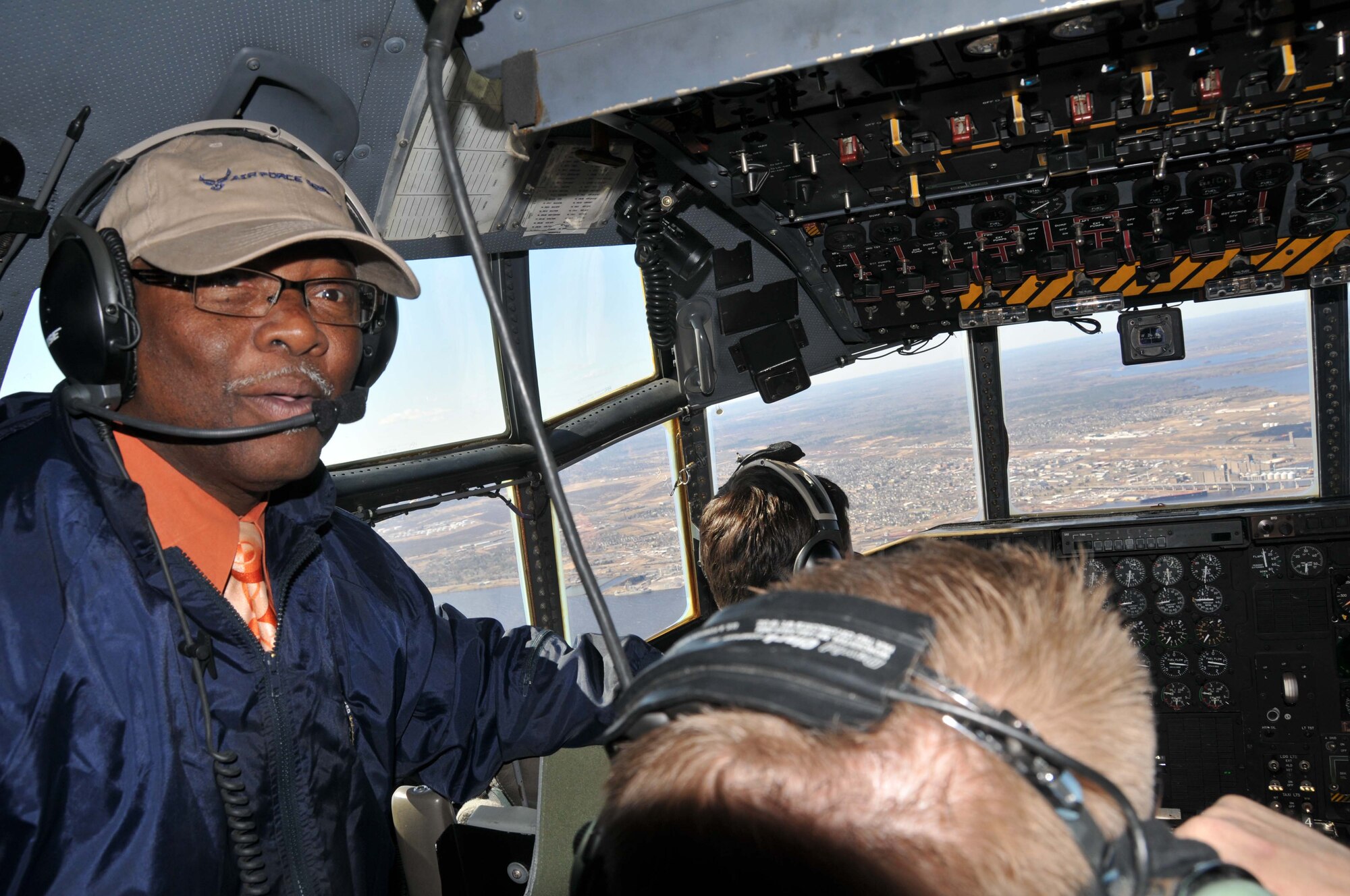 Dr. Troy Vincent, Principal of Farnsworth Aerospace School in St. Paul, gets
a view from the cockpit of a 934th Airlift Wing C-130 as it flies over
Duluth during Educators Day April 22. (Air Force Photo/Paul Zadach)

 

