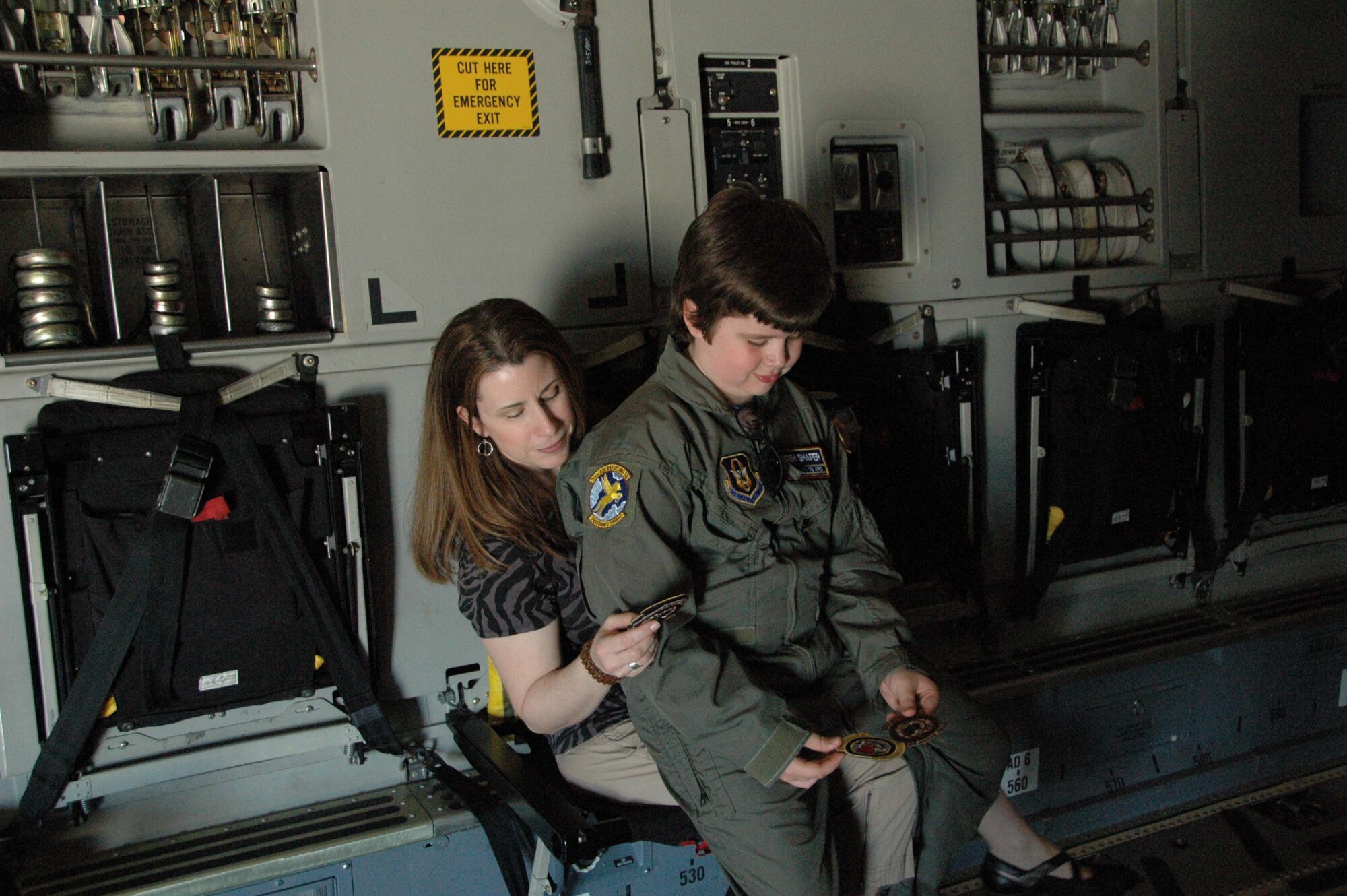MCGUIRE AIR FORCE BASE, N.J. - Josh Shafer, a 10-year old cancer survivor was Hero for the Day here in April. Here he inspects patches given to him by a member of the 732nd Airlift Squadron.  (U.S. Air Force photo/Staff Sgt. Monica Dalberg)