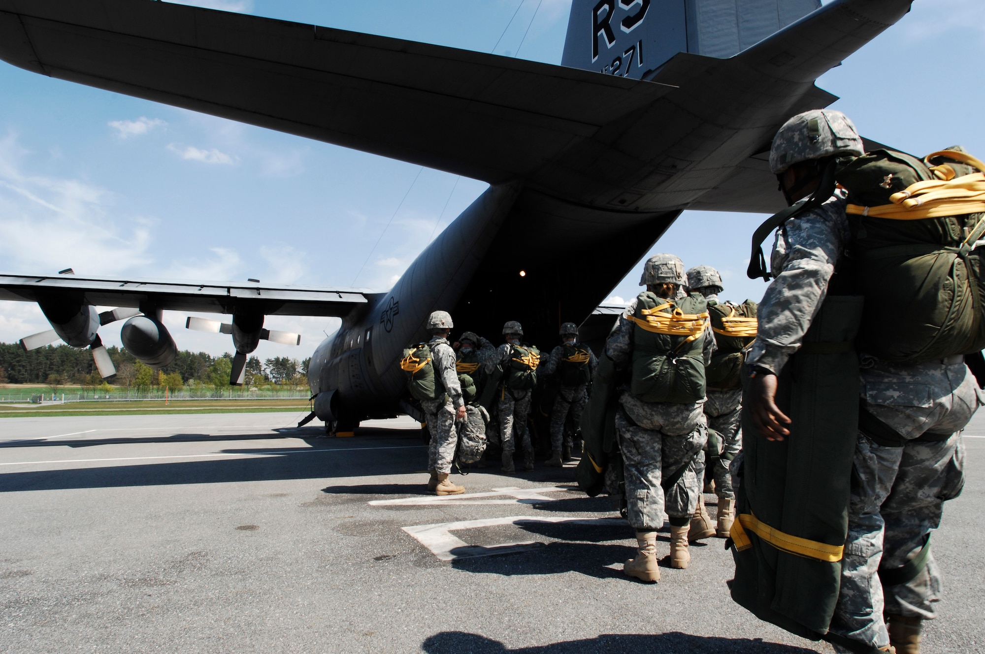 Members from the 173rd Airborne Brigade Combat Team board a C-130E Hercules aircraft for their quarterly training jump in Grafenwoehr Army Airfield, Germany, April 22, 2009. The 173rd ABCT has a proud history of service with combat jumps in Vietnam and Iraq during the first days of Operation Iraqi Freedom. (U.S. Air Force photo by Senior Airman Amber Bressler)
