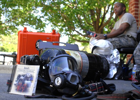 Staff Sgt. Theodonte Wiseman, 4th Aerospace Medicine Squadron, removes his protective gear after investigating a suspicious package as part of a hazardous-material training exercise at Seymour Johnson Air Force Base, N.C., April 21, 2009. As a bioenvironmental engineering technician, Sergeant Wiseman teamed with an emergency-management specialist to indentify and quantify a hazardous substance that leaked from the suspicious package. Both members of the hazardous-material response team wore fully-encapsulating protective suits with powered, self-contained breathing apparatus. (U.S. Air Force photo by Staff Sgt. Shawn J. Jones)