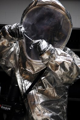 Senior Airman Jonathan Dodson, 4th Civil Engineer Squadron, investigates chemicals leaking from a suspicious package as part of a hazardous-material training exercise at Seymour Johnson Air Force Base, N.C., April 21, 2009. As an emergency management specialist, Airman Dodson joined a bioenvironmental engineering technician to form a hazardous-material response team. During the exercise, the team investigated, indentified and quantified the hazardous chemicals and relayed the information to the emergency operations centers. (U.S. Air Force photo by Airman 1st Class Whitney S. Lambert)