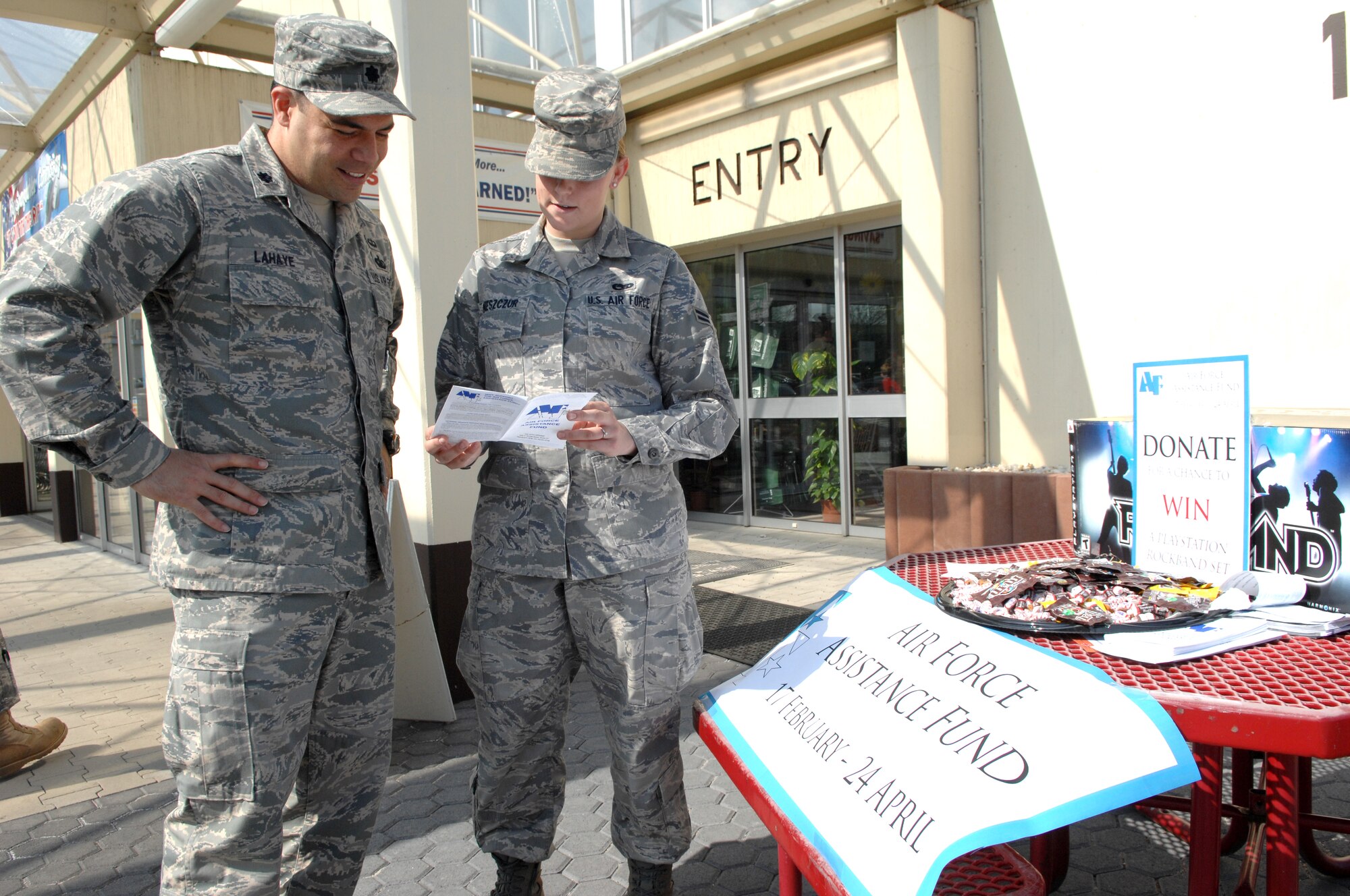 SPANGDAHLEM AIR BASE, GERMANY – Airman 1st Class Nicole Nieszcur, Air Force Assistance Fund volunteer, briefs Lt. Col. Dwayne Lahaye, 52nd Comptrollers commander, on this year’s campaign and requests a donation April 10, 2009. (U.S. Air Force photo by Master Sgt. Bill Gomez) 