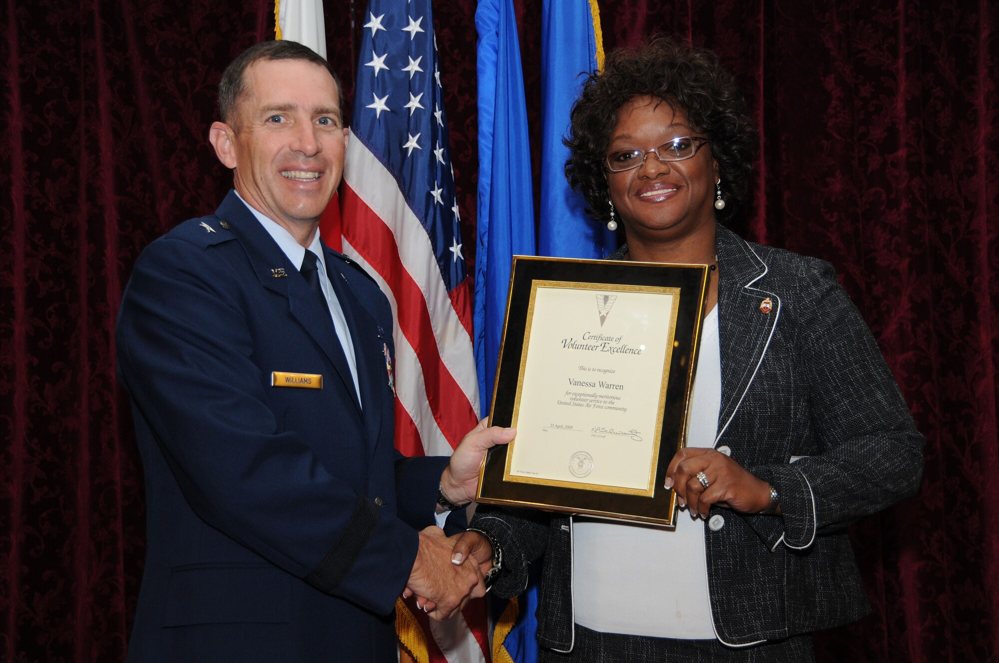 Mrs. Vanessa Warren, from the Kadena Parent Teacher Organization, is presented the Volunteer Excellence Award during the Annual Volunteer Recognition Ceremony at Kadena Air Base April 23. 
(U.S. Air Force photo/Staff Sgt. Darnell Cannady)