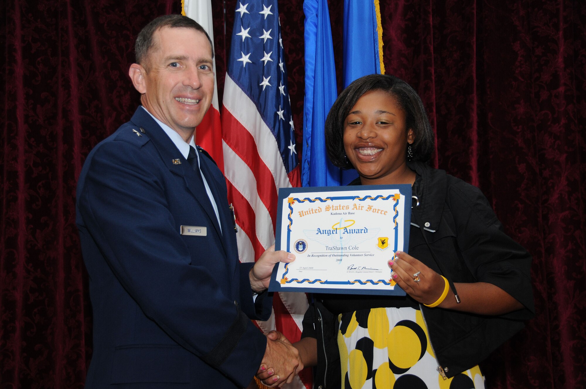 Miss TraShawn Cole, from the Youth Center, is presented the Category 5- Youth Recipient Angel Award during the Annual Volunteer Recognition Ceremony at Kadena Air Base April 23. 
(U.S. Air Force photo/Staff Sgt. Darnell Cannady)