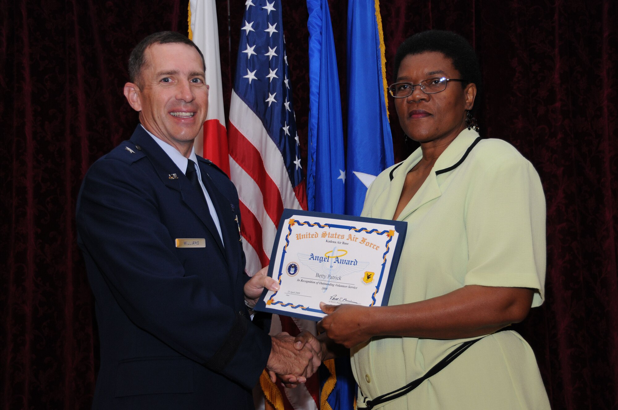Mrs. Betty Patrick, from the Loan Locker, is presented the Category 4- Retiree Recipient Angel Award during the Annual Volunteer Recognition Ceremony at Kadena Air Base April 23. 
(U.S. Air Force photo/Staff Sgt. Darnell Cannady)