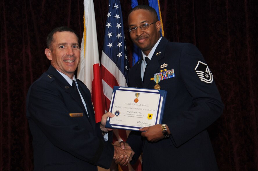 Master Sgt. Delmus Gillis is presented the Military Outstanding Volunteer Service Medal during the Annual Volunteer Recognition Ceremony at Kadena Air Base April 23. 
(U.S. Air Force photo/Staff Sgt. Darnell Cannady)
