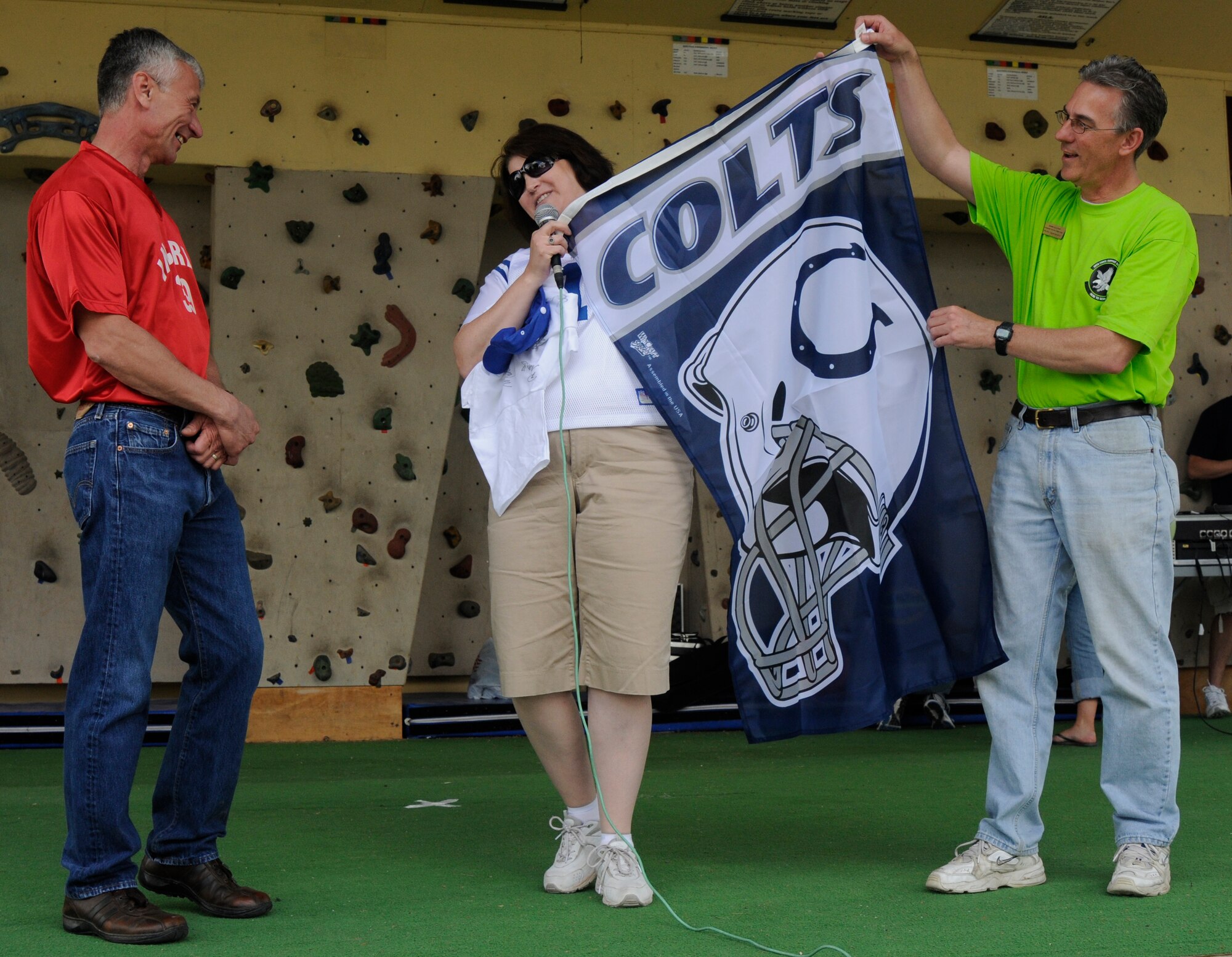 Col. Philip McDaniel, 39th Air Base Wing commander, is presented gifts from the Indianapolis Colts cheerleaders representative Theresa Pottratz and Mark Sullivan, 39th Force Support squadron community services flight chief, April 25, 2009 at Incirlik’s Spring Fling at Incirlik Air Base, Turkey. Every year, the Spring Fling is held to help celebrate the incoming warm season with at least three hundred base attendants. With food, music, crafts and children friendly events, this year’s Spring Fling also showcased the Indianapolis Colts cheerleaders.  (U.S. Air Force photo/Airman 1st Class Amber Russell)