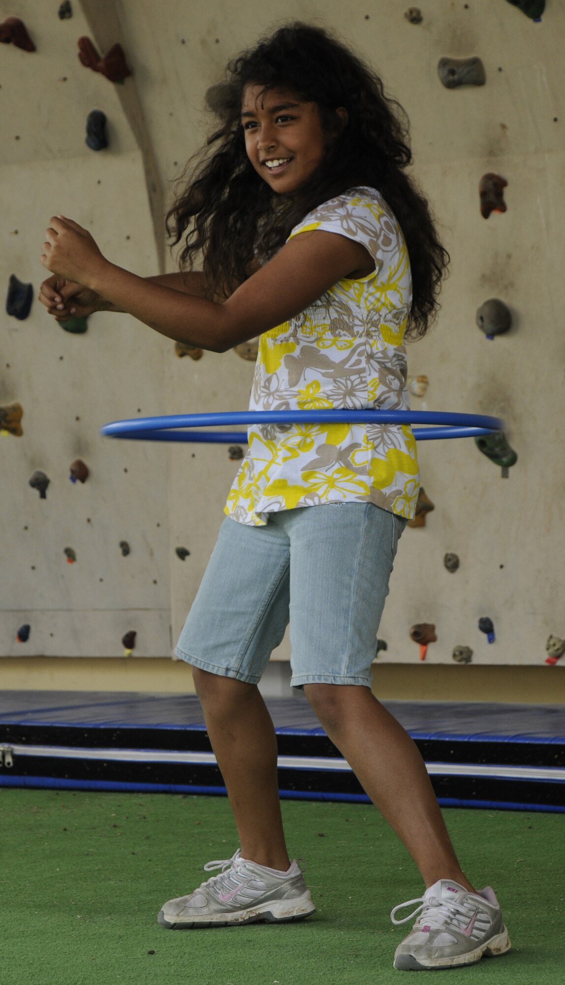 Breonna, daughter of Tech Sgt. David Garrett, 728th Air Mobility Squadron, partakes in a hula hoop competition against three others and an Indianapolis Colts cheerleader April 25, 2009 at Incirlik’s Spring Fling at Incirlik Air Base, Turkey.  Every year, the Spring Fling is held to help celebrate the incoming warm season with at least three hundred base attendants. With food, music, crafts and children friendly events, this year’s Spring Fling also showcased the Indianapolis Colts cheerleaders.  (U.S. Air Force photo/Airman 1st Class Amber Russell)