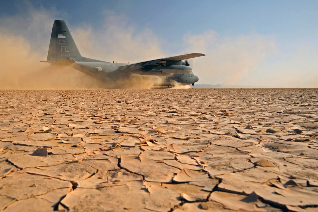 A U.S. Air Force C-130P aircraft lands on a dry lake bed during a search and rescue exercise on Grand Bara, Djibouti, April 23, 2009. The air crew is assigned to the 81st Rescue Squadron. The exercise consisted of transporting pararescuemen to a water jump, aerial refueling of a CH-53E helicopter, an assault landing on an unimproved runway, and transloading a simulated survivor from the CH-53E.    
