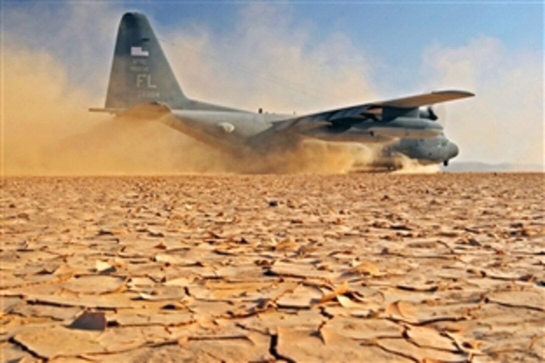A U.S. Air Force C-130P aircraft lands on a dry lake bed during a search and rescue exercise on Grand Bara, Djibouti, April 23, 2009. The air crew is assigned to the 81st Rescue Squadron. The exercise consisted of transporting pararescuemen to a water jump, aerial refueling of a CH-53E helicopter, an assault landing on an unimproved runway, and transloading a simulated survivor from the CH-53E. 