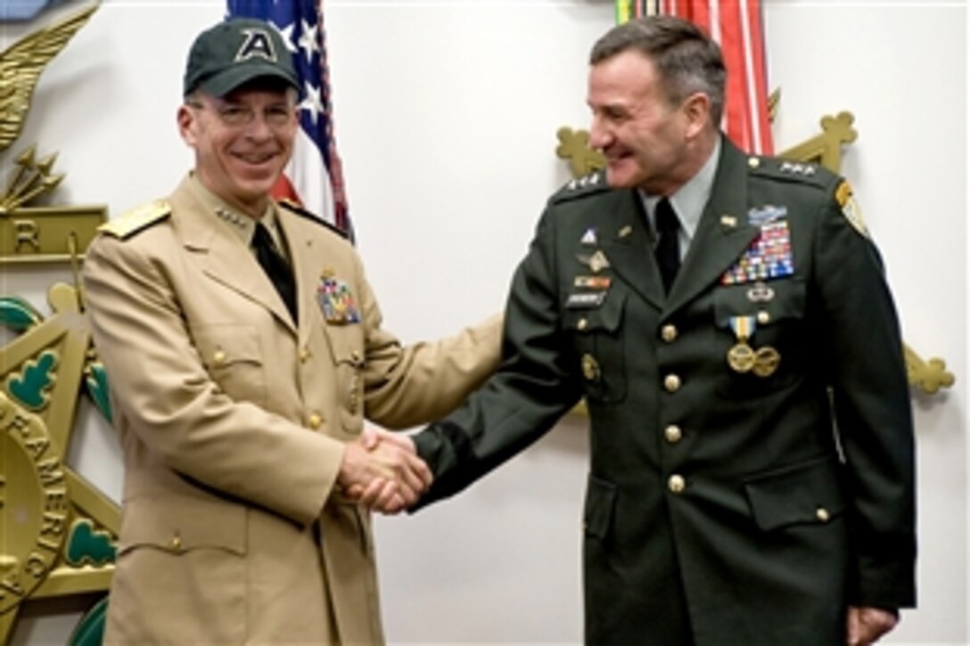 U.S. Navy Adm. Mike Mullen, chairman of the Joint Chiefs of Staff, dons a U.S. Army ball cap at the end of the retirement ceremony for U.S. Army Lt. Gen. Karl Eikenberry at the Hall of Heroes, Pentagon, April 28, 2009. Eikenberry is retiring after 35 years of service and will be sworn in as the U.S. ambassador to Afghanistan in a ceremony by Secretary of State Hillary Clinton.








