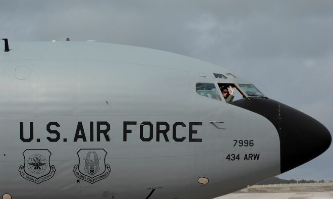 A pilot from the 434th Air Refueling Wing from Grissom Air Reserve Base, waves farewell from a KC-135R Stratotanker April 29 at Andersen Air Force Base, Guam. The 434th Air Refueling Wing from Grissom recently completed a deployment to Andersen in support of Pacific Refueling Operations. During the 120 day deployment they accomplished 162 missions, flew 654 hours, off loaded over 8.2 million pounds of fuel with an overall mission capability rate of 96.2 percent. The 452nd Air Mobility Wing March Air Reserve Base, Calif. will take over Andersen refueling operations. (U.S. Air Force photo/Master Sgt. Kevin J. Gruenwald)