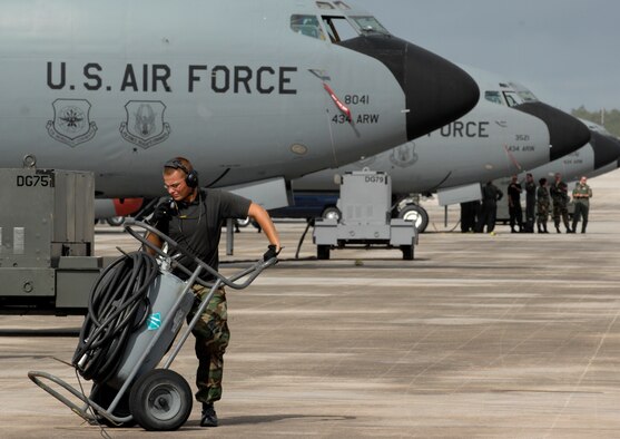 Senior Airman David Engelhardt, crew chief moves a fire bottle April 29 at Andersen Air Force Base, Guam. The 434th Air Refueling Wing from Grissom Air Reserve Base, Indiana recently completed a  deployment to Andersen in support of Pacific Refueling Operations. During the 120 day deployment they accomplished 162 missions, flew 654 hours, off loaded over 8.2 million pounds of fuel with an overall mission capability rate of 96.2 percent.  The 452nd Air Mobility Wing March Air Reserve Base, Calif., will take over Andersen refueling operations. 
 
 (U.S. Air Force photo/ Master Sgt. Kevin J. Gruenwald) released

 




















  












 











































  












 

























