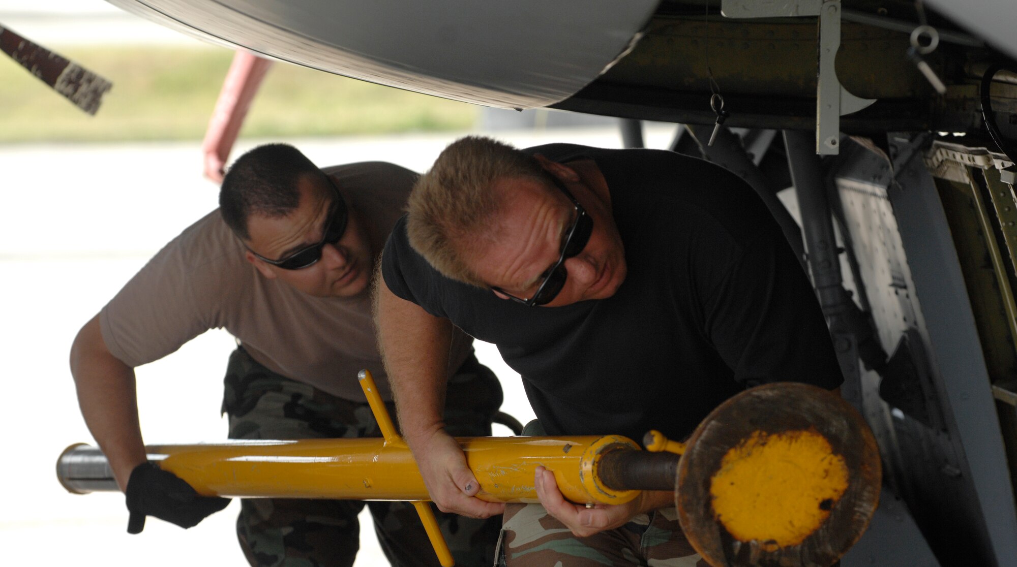 Tech. Sgt. Mike Harlow and Senior Aaron Preston KC-135R Stratotanker crew chiefs move a cargo loading stand April 29 at Andersen Air Force Base, Guam. The 434th Air Refueling Wing from Grissom Air Reserve Base, Indiana recently completed a deployment to Andersen in support of Pacific Refueling Operations. During the 120 day deployment they accomplished 162 missions, flew 654 hours, off loaded over 8.2 million pounds of fuel with an overall mission capability rate of 96.2 percent.  The 452nd Air Mobility Wing, March Air Reserve Base, Calif., will take over Andersen refueling operations. 
 
. 
 
(U.S. Air Force photo/ Master Sgt. Kevin J. Gruenwald) released


















  












 











































  












 

























