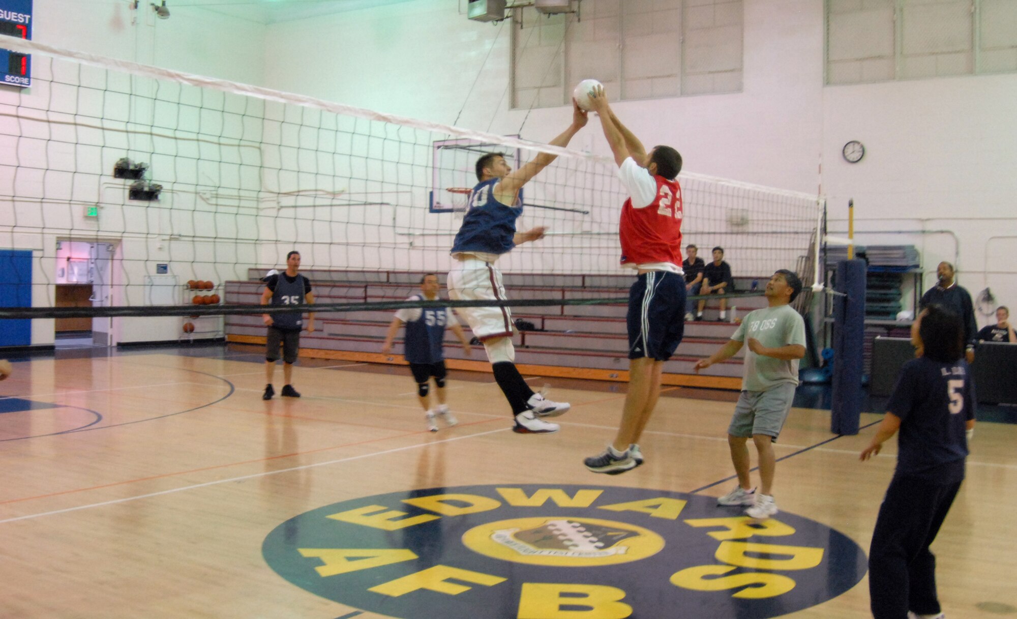 Matt Keller (right), 417th Flight Test Squadron team member, blocks the spike attempt of Carsten Stahr (left), 31st Test and Evaluation Squadron team member, during a volleyball game April 27 in the Rosburg Fitness Center. The 417th FLTS defeated the 31st TES, 2-0 in the best-of-three match-up. (Air Force photo/Airman 1st Class William O'Brien)