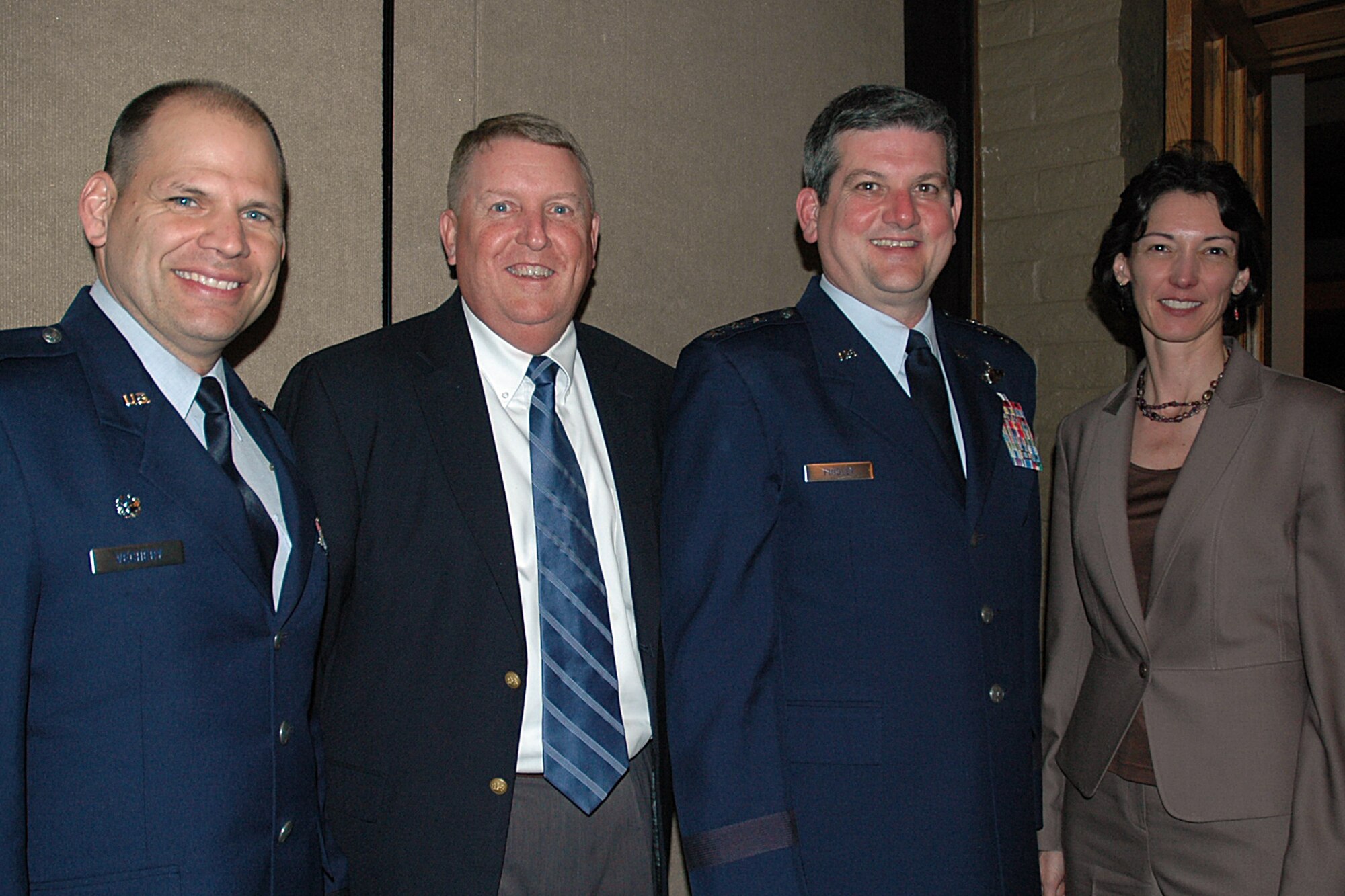 MCCONNELL AIR FORCE BASE, Kan. -- Col. James C. Vechery, 22nd Air Refueling Wing commander, (retired) Col. David J. Kramer, former 22nd Air Refueling Wing vice commander from June 2002 to August 2005, Lt. Gen. Vern M. “Rusty” Findley, Air Mobility Command, vice-commander, and (retired) Col. Cathy C. Clothier, former 22nd Air Refueling wing commander, from June 2004 to February 2006 gather during the Friends of McConnell dinner at the Crestview Country Club in Wichita on April 23. General Findley spoke to the group about the importance and the flexibility of the tanker in the AMC mission. (Photo by Tech. Sgt. Genevieve Morris)