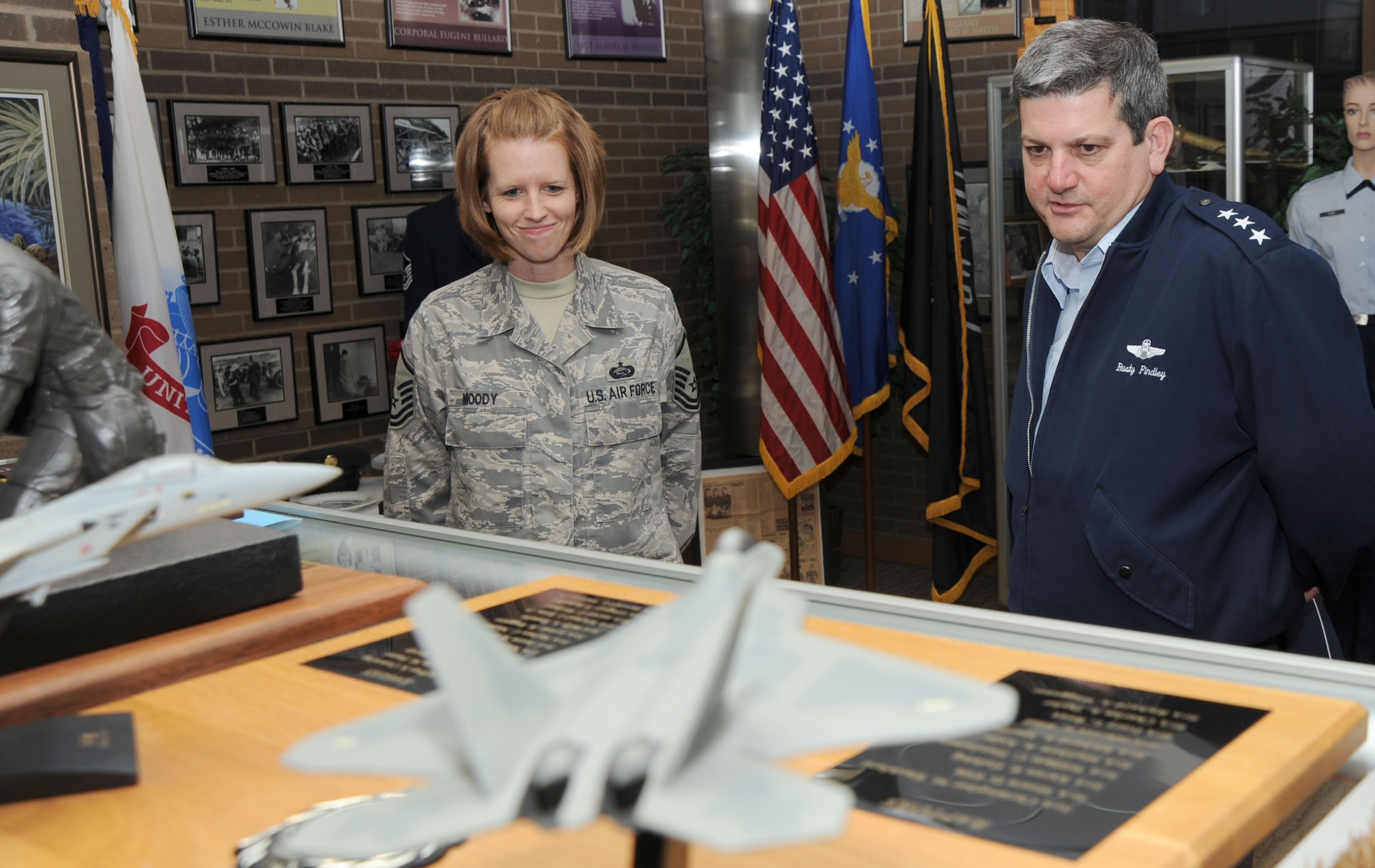 MCCONNELL AIR FORCE BASE, Kan. -- Lt. Gen. Vern M. “Rusty” Findley, Air Mobility Command, vice-commander, views McConnell’s rich heritage while Master Sgt. Heather Moody, 22nd Force Support Squadron, briefs him at the Robert J. Dole Community Center, April 23. This is Gen. Findley’s first visit to McConnell Air Force Base since he became the AMC vice commander in June 2008. (Photo by Senior Airman Roy Lynch) 