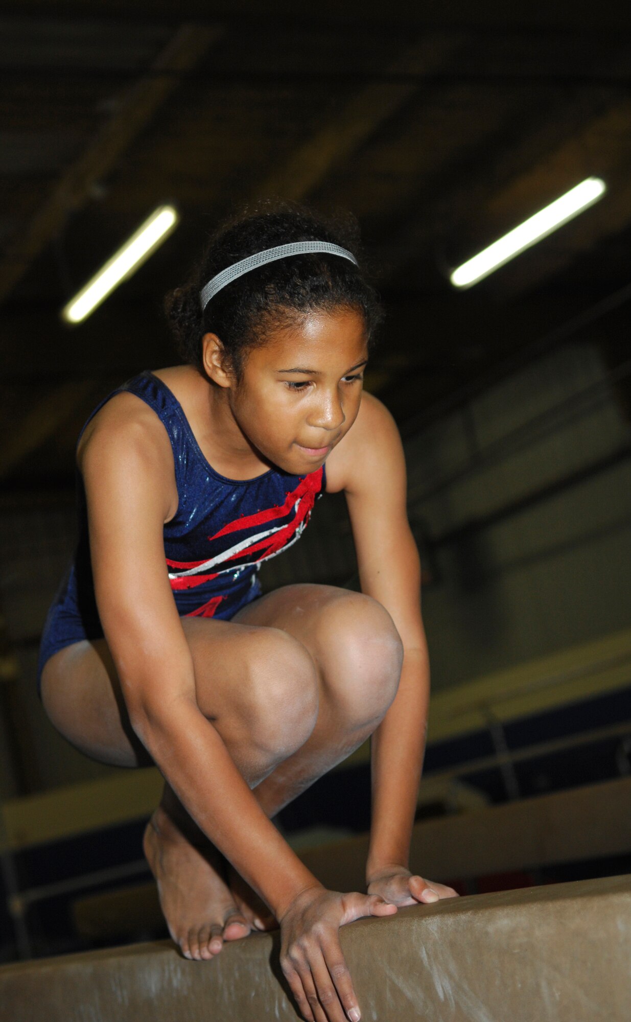 VANDENBERG AIR FORCE BASE, Calif.--  Twelve-year-old Khamis Peoples participates in balance beam exercises during gymnastics class at the youth center here April 23. Khamis excels in school, sports and is involved in numerous community programs. (U.S. Air Force photo/Airman 1st Class Heather R. Shaw)