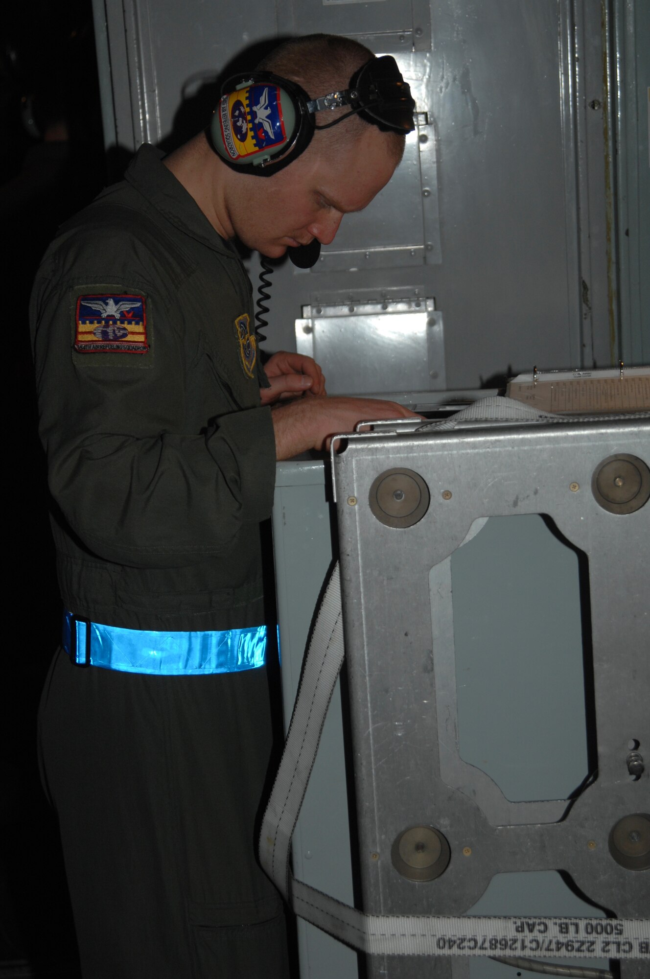 Airman 1st Class Philip Inmon, 384th Air Refueling Squadron boom, reviews pre-flight checklist ensuring the aircraft is prepared to take off in support of a multi lateral exercise, April 16. (Photo by Staff Sgt. Ronald Lafosse)