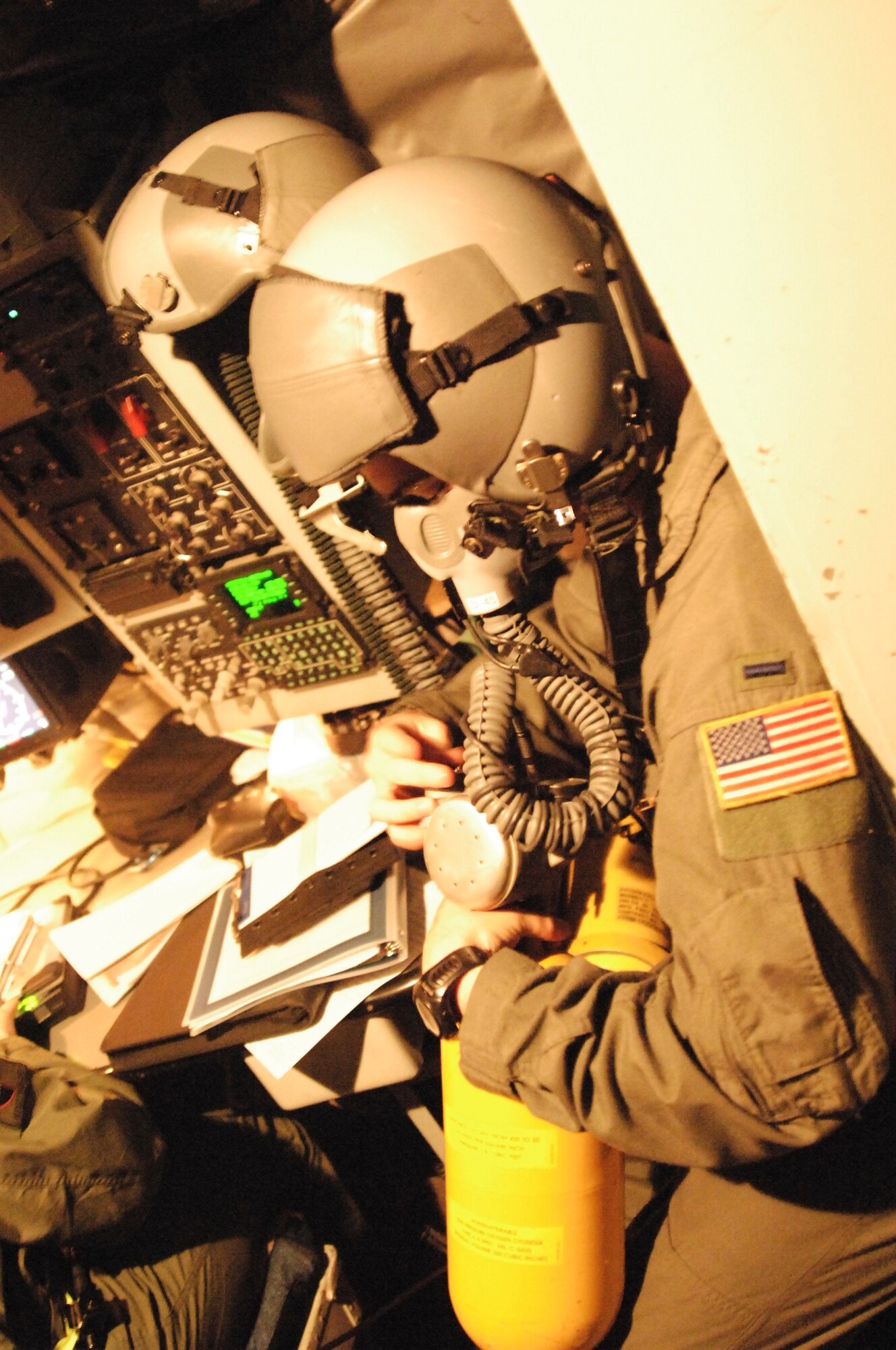 1st Lt. Joseph Bertapelle, 384th Air Refueling Squadron, performs an operational check of his oxygen equipment before taking off in support of a multi lateral sortie, April 16.  This equipment allows the aircrew to descend to a safe altitude should an aircraft become depressurized in flight. (Photo by Staff Sgt. Ronald Lafosse)