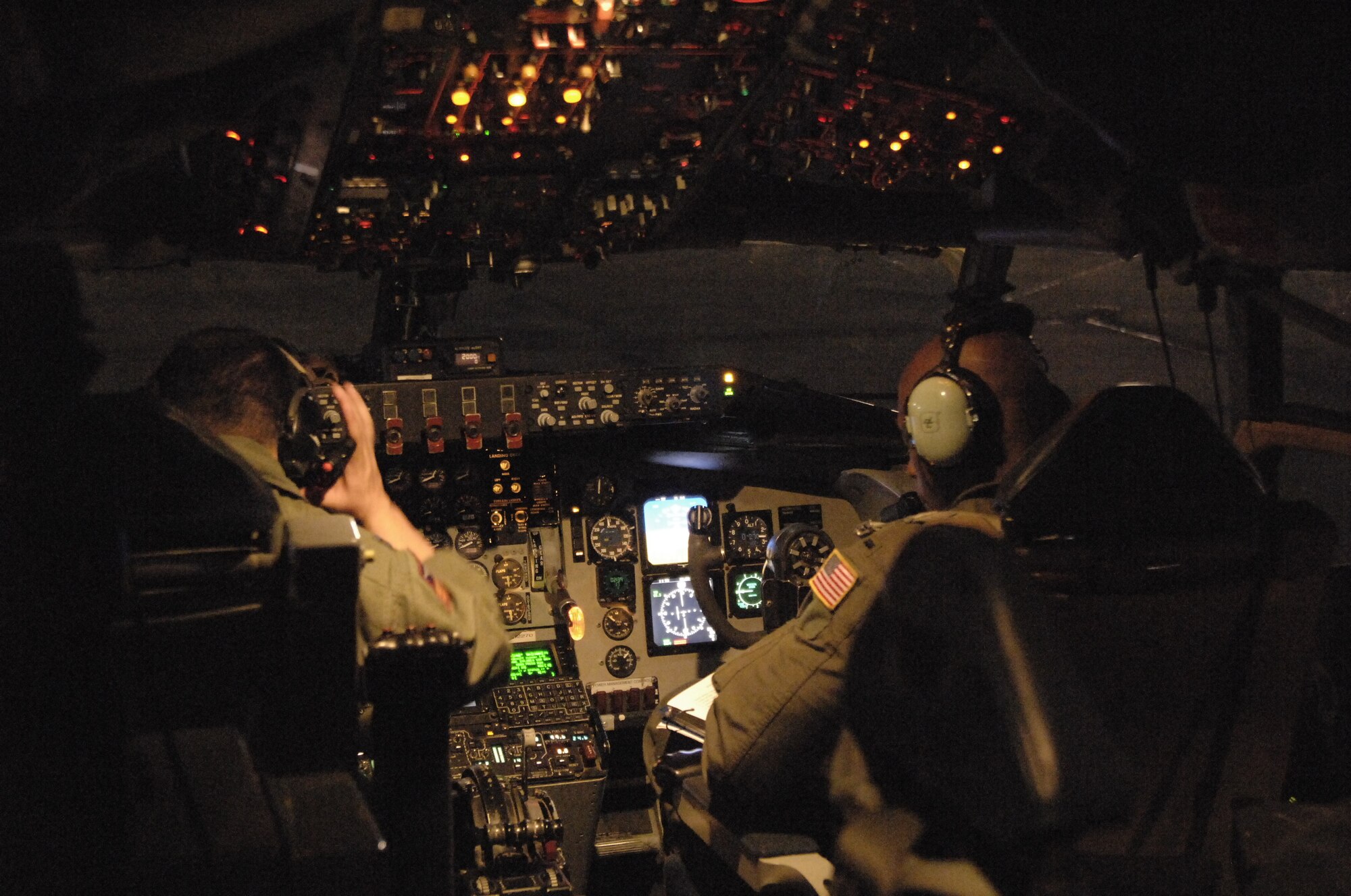 Capt. Samuel Dixon, 384th Air Refueling Squadron pilot, and 1st Lt. Sean Mitchell, 384th ARS co-pilot, perform a pre-flight inspection of the aircraft systems prior to taking off in support of a multi lateral sortie, April 16.  This inspection identifies any system not performing correctly. (Photo by Staff Sgt. Ronald Lafosse)